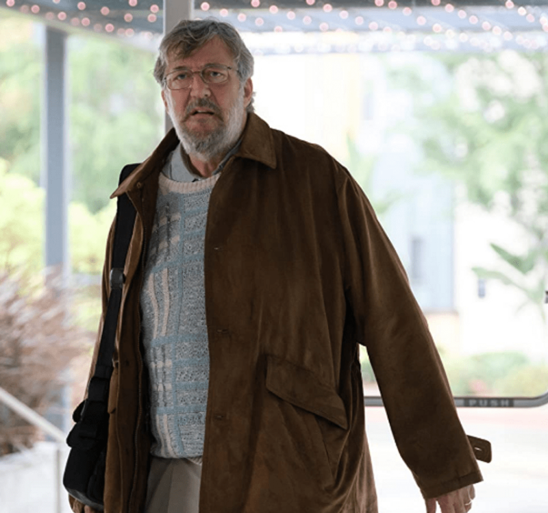 The dropout Stephen Fry brown jacket