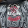 Product Specification: Material: woolen Color: black and red Collar: hooded collar Sleeves: full-length sleeves Cuffs: rib-knitted cuffs Front: zippered front Pockets: two side pockets